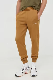Spodnie męskie - Calvin Klein spodnie dresowe męskie kolor brązowy gładkie - grafika 1