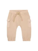Spodenki dla niemowląt - Noppies Spodnie dresowe "Orion" w kolorze beżowym - miniaturka - grafika 1