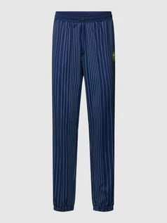 Spodnie sportowe męskie - Spodnie dresowe ze wzorem w paski model ‘TAARSTEDT STRIPED’ - grafika 1