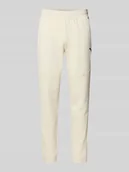 Spodnie sportowe męskie - Spodnie dresowe o kroju regular fit z nadrukiem z logo model ‘Pumatech’ - miniaturka - grafika 1