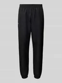 Spodnie sportowe męskie - Spodnie treningowe o kroju relaxed fit z naszywką z logo - miniaturka - grafika 1