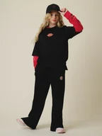 Spodnie i spodenki dla dziewczynek - 4F Spodnie dresowe z szerokimi nogawkami dziewczęce - czarne 164 (13-14 lat) - miniaturka - grafika 1