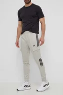 Spodnie męskie - adidas spodnie dresowe TIRO kolor zielony z aplikacją IS1544 - miniaturka - grafika 1