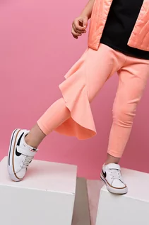 Spodnie i spodenki dla dziewczynek - vavu Pomarańczowe legginsy z falbanką SUZI - grafika 1