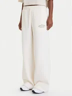 Spodnie sportowe damskie - New Balance Spodnie dresowe WP53902 Biały Relaxed Fit - miniaturka - grafika 1