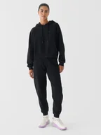 Spodnie sportowe damskie - 4F Spodnie dresowe oversize damskie 4F x Anna Lewandowska - czarne XS - miniaturka - grafika 1