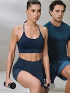 Bielizna sportowa damska - 4F Biustonosz treningowy bezszwowy z niskim wsparciem damski - turkusowy XS/S - miniaturka - grafika 1