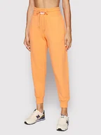 Spodnie sportowe damskie - New Balance Spodnie dresowe WP21503 Pomarańczowy Relaxed Fit - miniaturka - grafika 1