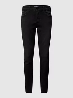 Spodnie męskie - Jeansy w dekatyzowanym stylu o kroju slim fit - grafika 1