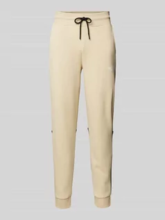 Spodnie sportowe męskie - Spodnie dresowe o kroju regular fit z nadrukiem z logo model ‘ICONS’ - grafika 1
