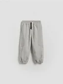 Spodenki dla niemowląt - Reserved - Bawełniane joggery - jasnoszary - miniaturka - grafika 1