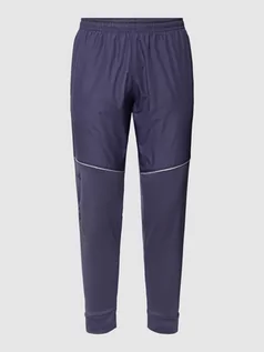 Spodnie sportowe męskie - Spodnie dresowe z detalem z logo model ‘Storm’ - grafika 1