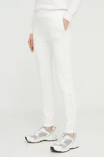Spodnie damskie - Armani Exchange spodnie dresowe kolor beżowy gładkie - grafika 1