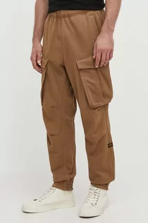 Spodnie męskie - G-Star Raw spodnie dresowe kolor beżowy gładkie - grafika 1