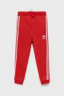 Spodnie damskie - Adidas Originals Originals spodnie dziecięce kolor czerwony z aplikacją - grafika 1