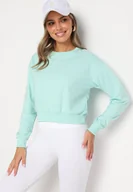 Bluzy damskie - Miętowa Bluza z Dodatkiem Bawełny Wykończona Ściągaczami Evilaya - miniaturka - grafika 1