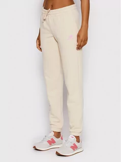 Spodnie sportowe damskie - New Balance Spodnie dresowe WP21508 Beżowy Regular Fit - grafika 1