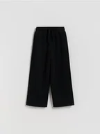 Spodnie i spodenki dla chłopców - Reserved - Dzianinowe spodnie z bawełną - czarny - miniaturka - grafika 1