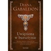 Literatura przygodowa - ŚWIAT KSIĄŻKI Uwięziona w bursztynie (elegancka edycja) - Diana Gabaldon - miniaturka - grafika 1