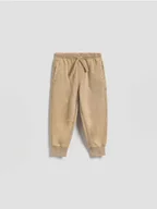 Spodenki dla niemowląt - Reserved - Bawełniane joggery - beżowy - miniaturka - grafika 1