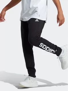 Spodnie sportowe męskie - adidas Spodnie dresowe Essentials French Terry Tapered Cuff Logo Joggers IC0063 Czarny Regular Fit - grafika 1