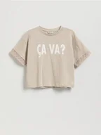 Koszulki dla dziewczynek - Reserved - Krótki t-shirt z nadrukiem - kremowy - miniaturka - grafika 1