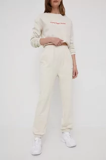 Spodnie damskie - Calvin Klein Jeans Jeans spodnie dresowe bawełniane damskie kolor beżowy z aplikacją - grafika 1