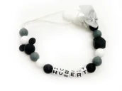 Akcesoria do smoczków - Silikonowa zawieszka do smoczka z imieniem DOWOLNE IMIĘ kolor czarny - miniaturka - grafika 1