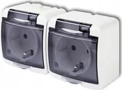 Gniazdka elektryczne - Karlik Gniazdo hermetyczne Karlik Junior GHE-2SDP natynkowe podwójne z uziemieniem IP54 schuko z przesłonami klapka transparentna białe - miniaturka - grafika 1