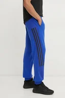 Spodnie męskie - adidas spodnie Future Icons męskie kolor niebieski wzorzyste IV5131 - miniaturka - grafika 1