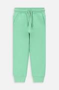 Spodnie i spodenki dla dziewczynek - Coccodrillo spodnie dresowe bawełniane dziecięce kolor zielony gładkie - miniaturka - grafika 1