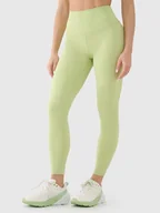 Spodnie sportowe damskie - 4F Legginsy funkcyjne w kolorze żółtym - miniaturka - grafika 1