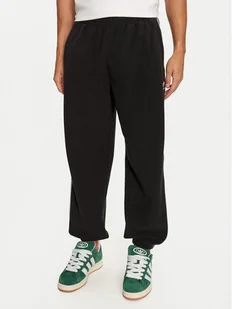 adidas Spodnie dresowe adicolor 3-Stripes IZ4798 Czarny Regular Fit - Spodnie sportowe męskie - miniaturka - grafika 1