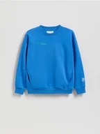 Kurtki i płaszcze dla chłopców - Reserved - Bawełniana bluza oversize - niebieski - miniaturka - grafika 1