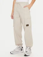 Spodnie sportowe męskie - Champion Spodnie dresowe 220415 Écru Loose Fit - miniaturka - grafika 1