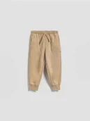 Spodenki dla niemowląt - Reserved - Bawełniane joggery - beżowy - miniaturka - grafika 1