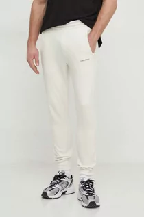 Spodnie męskie - Calvin Klein spodnie dresowe kolor beżowy gładkie - grafika 1