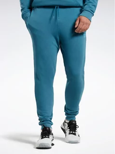 Spodnie sportowe męskie - Reebok Spodnie dresowe Reebok Identity French Terry Joggers H49680 Niebieski Regular Fit - grafika 1