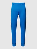 Spodnie sportowe męskie - Spodnie dresowe z naszywką z logo model ‘TRACKSUIT TROUSERS’ - miniaturka - grafika 1