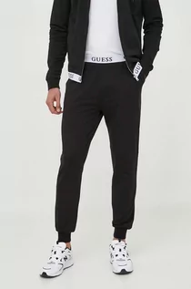 Spodnie męskie - Guess spodnie dresowe kolor czarny gładkie - grafika 1