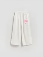 Spodnie i spodenki dla dziewczynek - Reserved - Spodnie dresowe z nadrukiem - złamana biel - miniaturka - grafika 1