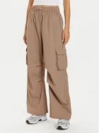 Spodnie sportowe damskie - New Balance Spodnie dresowe WP43534 Beżowy Relaxed Fit - miniaturka - grafika 1
