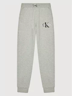 Spodnie i spodenki dla chłopców - Calvin Klein Jeans Spodnie dresowe Monogram Logo IB0IB00944 Szary Regular Fit - grafika 1
