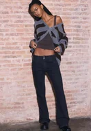 Spodnie damskie - Stradivarius Jeans z niskim stanem z cekinami CZARNY DENIM Z EFEKTEM SPRANIA 32 - miniaturka - grafika 1