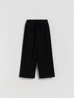 Spodnie i spodenki dla chłopców - Reserved - Dzianinowe spodnie z bawełną - czarny - miniaturka - grafika 1