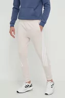 Spodnie męskie - adidas spodnie dresowe kolor różowy z nadrukiem IR9155 - miniaturka - grafika 1