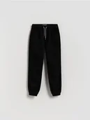 Spodnie i spodenki dla chłopców - Reserved - Bawełniane spodnie jogger - czarny - miniaturka - grafika 1