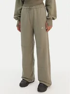 Spodnie sportowe damskie - adidas Spodnie dresowe JM1099 Zielony Regular Fit - miniaturka - grafika 1