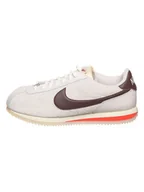Trampki damskie - Nike Skórzane sneakersy "Cortez '23" w kolorze kremowo-brązowym - miniaturka - grafika 1