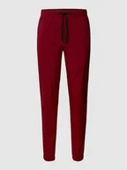Spodnie sportowe męskie - Spodnie treningowe o kroju relaxed tapered fit z nadrukiem z logo - miniaturka - grafika 1